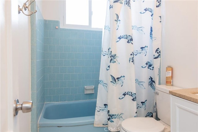 full bathroom featuring toilet, vanity, and shower / bath combination with curtain