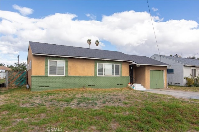 single story home with a front lawn and a garage