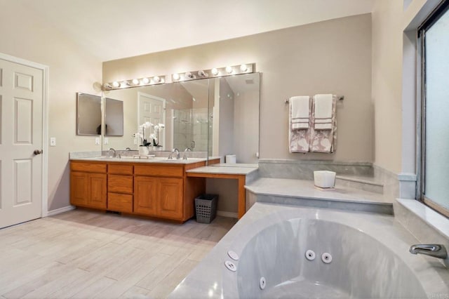 bathroom featuring vanity, lofted ceiling, and a washtub