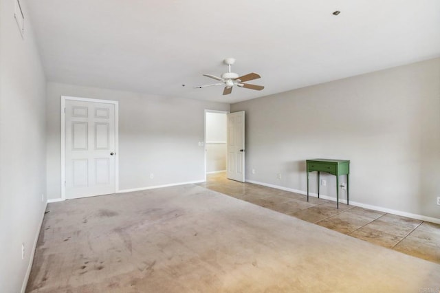 carpeted empty room with ceiling fan