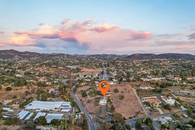 aerial view at dusk with a mountain view