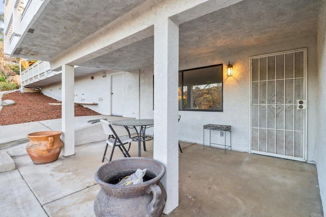 view of patio featuring an outdoor fire pit