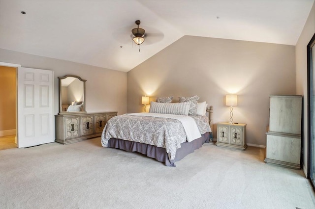 carpeted bedroom featuring ceiling fan and lofted ceiling