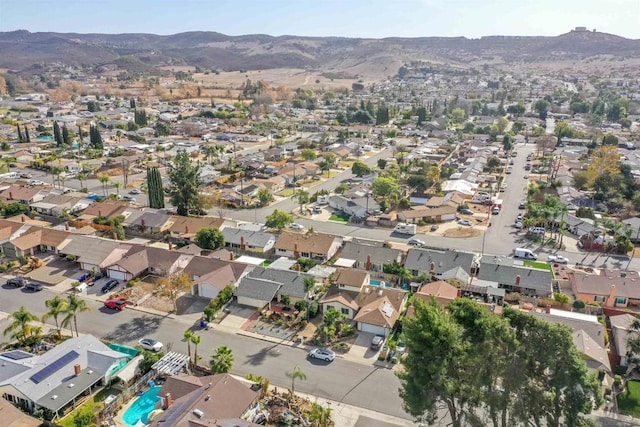 birds eye view of property with a mountain view