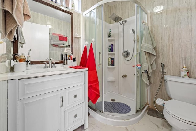 bathroom featuring walk in shower, vanity, and toilet