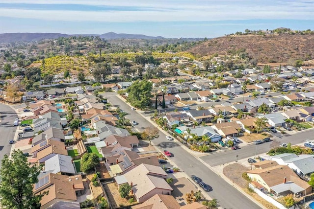 birds eye view of property with a mountain view