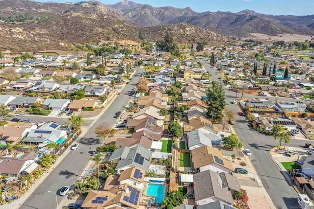 birds eye view of property with a mountain view