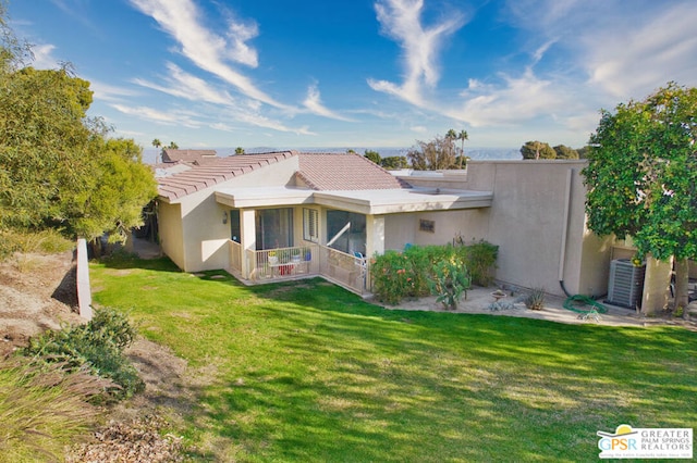 view of property exterior with a yard