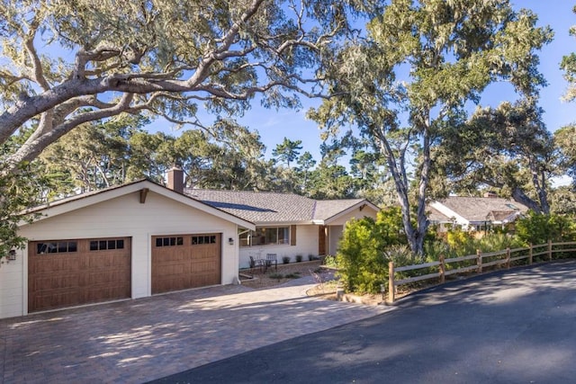 ranch-style house featuring a garage