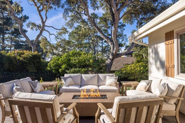 view of patio / terrace featuring an outdoor living space with a fire pit