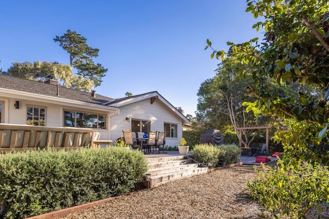 back of property with a patio area