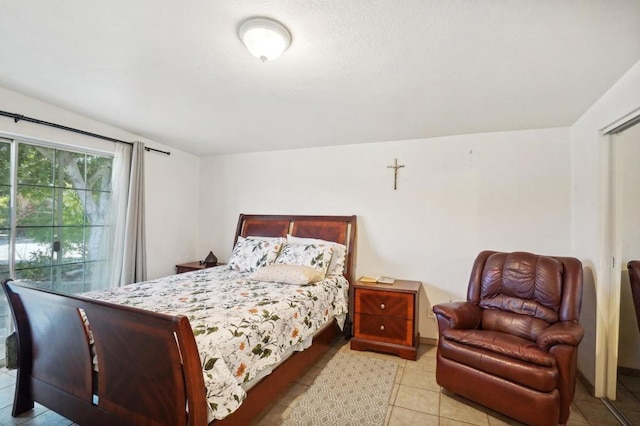 bedroom featuring light tile patterned floors