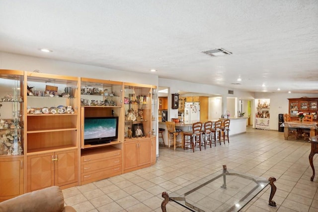 living room with light tile patterned floors