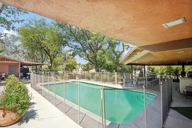 view of swimming pool with a patio area