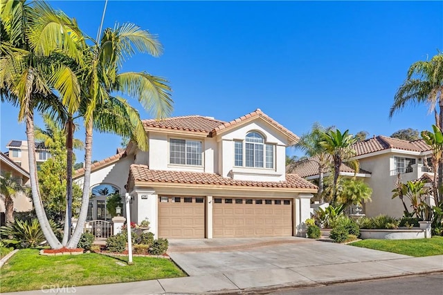 mediterranean / spanish-style home featuring a garage