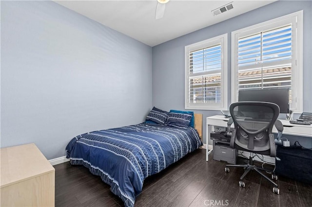 bedroom featuring ceiling fan and dark hardwood / wood-style flooring