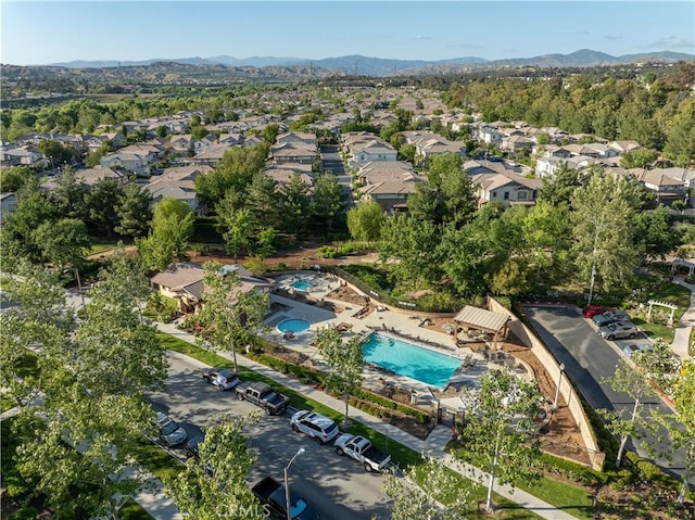 birds eye view of property with a mountain view