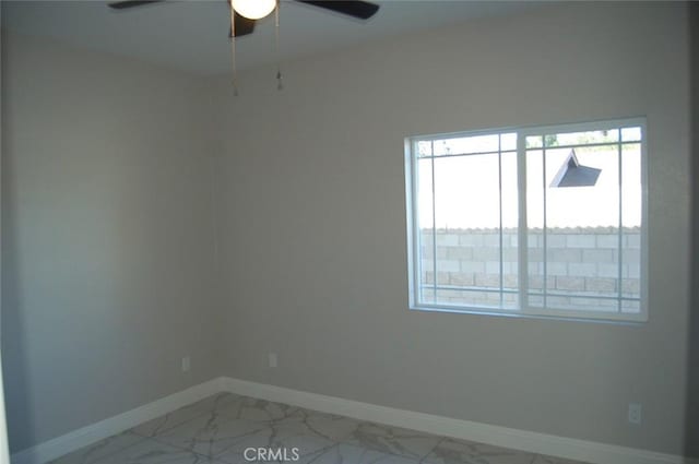 spare room featuring ceiling fan