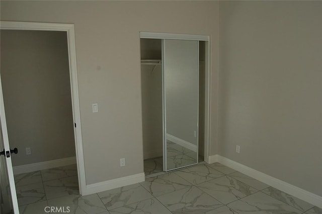 unfurnished bedroom with a closet