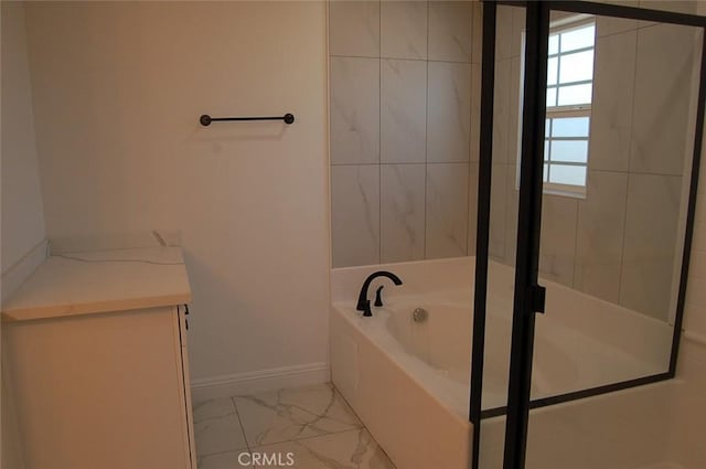 bathroom featuring a tub to relax in