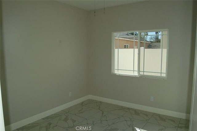 spare room featuring plenty of natural light