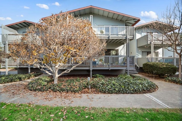 back of house with a balcony