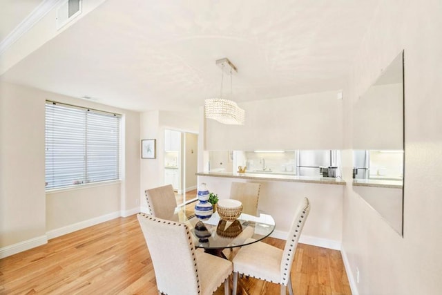 dining room featuring light hardwood / wood-style floors