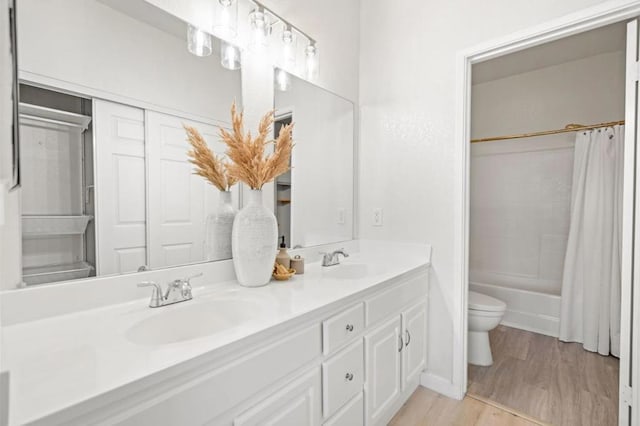 full bathroom featuring toilet, shower / tub combo, vanity, and hardwood / wood-style flooring