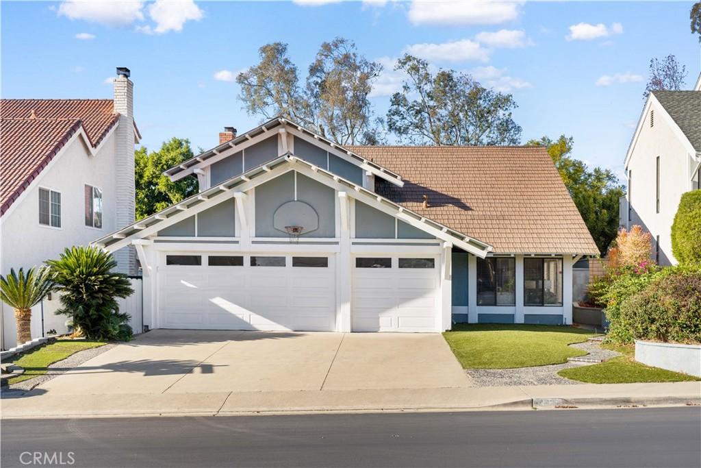 view of front of property with a garage and a front yard