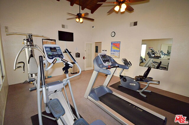 exercise room featuring ceiling fan, high vaulted ceiling, and wood ceiling