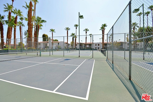 view of sport court featuring basketball hoop