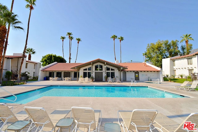 view of swimming pool featuring a patio area