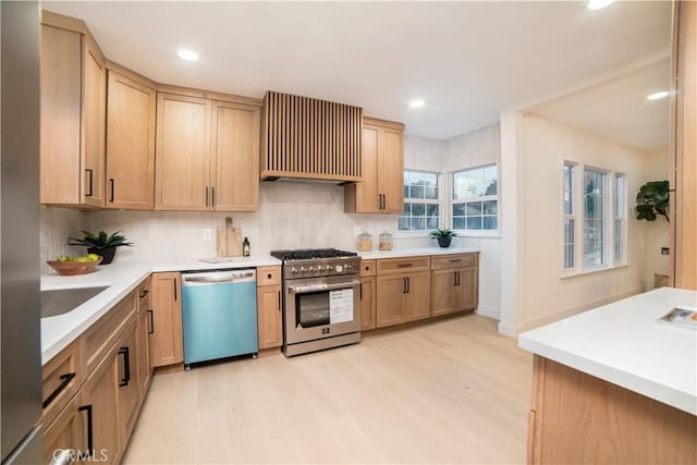 kitchen with light wood-type flooring, appliances with stainless steel finishes, backsplash, and custom range hood