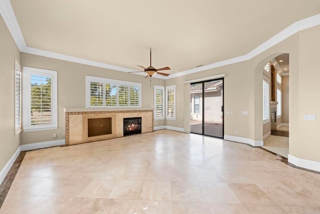 unfurnished living room featuring ceiling fan and ornamental molding