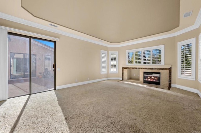 unfurnished living room with crown molding and carpet flooring