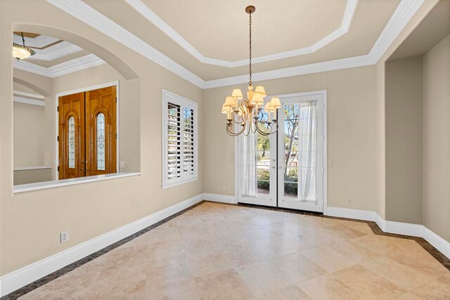 unfurnished dining area featuring a raised ceiling, a notable chandelier, and ornamental molding