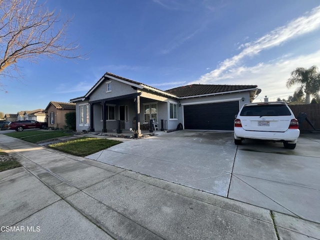 view of front of house with a garage and covered porch