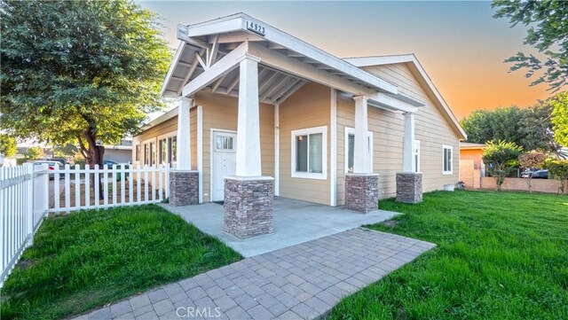 exterior space featuring a yard and a patio