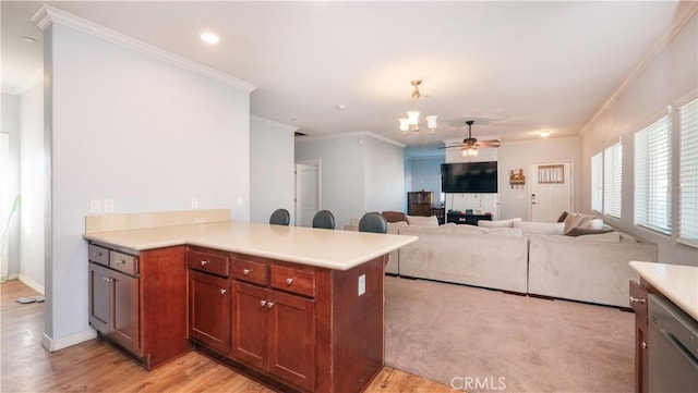 kitchen featuring kitchen peninsula, decorative light fixtures, dishwasher, ornamental molding, and ceiling fan with notable chandelier