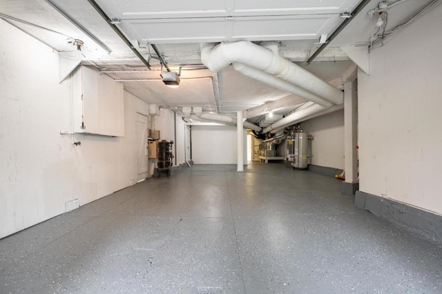 garage with water heater and a garage door opener