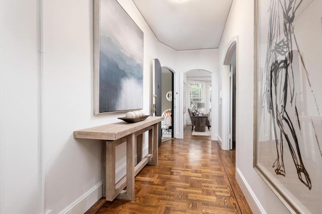 corridor with dark parquet flooring