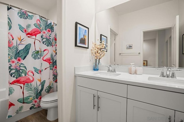 full bathroom featuring hardwood / wood-style flooring, toilet, vanity, and shower / bath combination with curtain