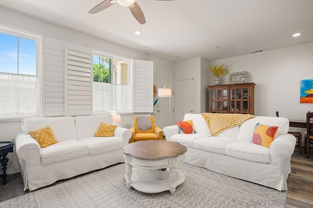 living room with hardwood / wood-style flooring and ceiling fan