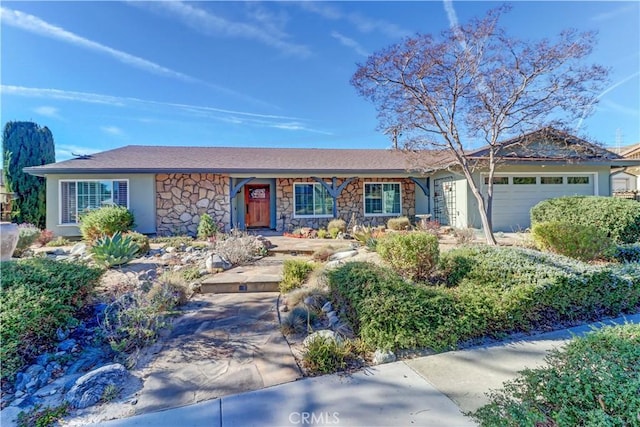 ranch-style home featuring a garage