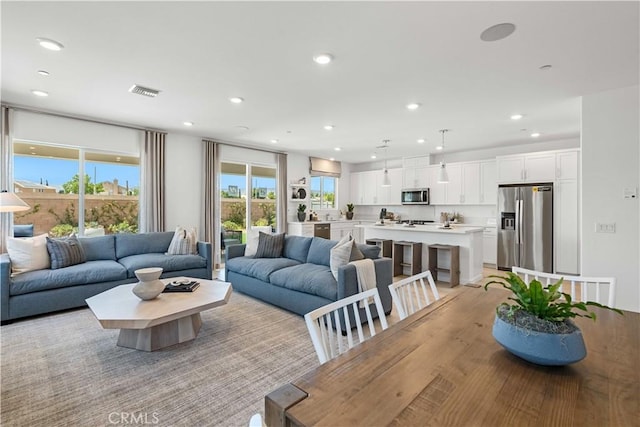 living room with light hardwood / wood-style floors