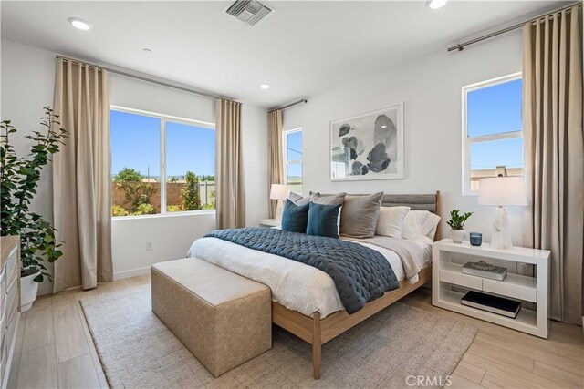 bedroom with light wood-type flooring