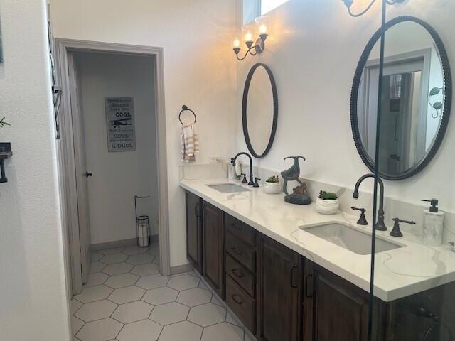 bathroom featuring vanity and tile patterned flooring