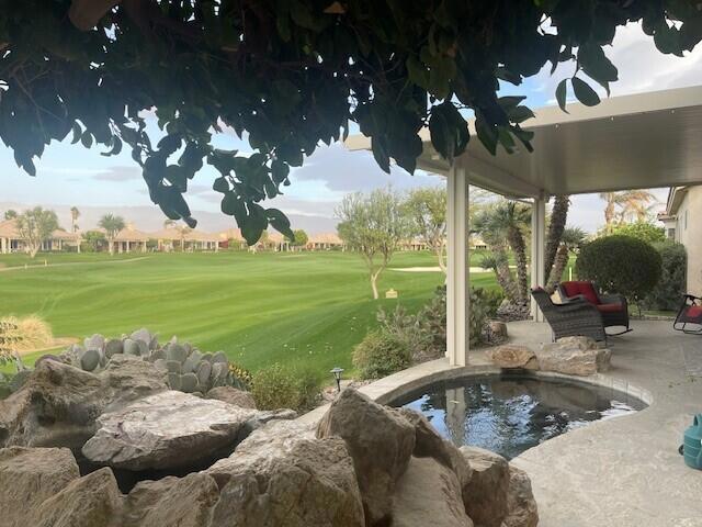 exterior space featuring a patio, a pool, and a yard