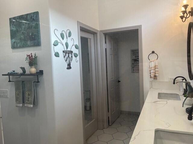 bathroom with tile patterned floors and vanity