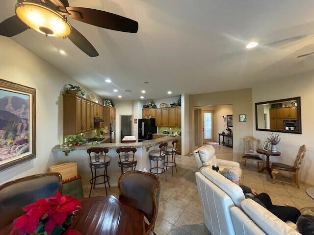 living room featuring ceiling fan